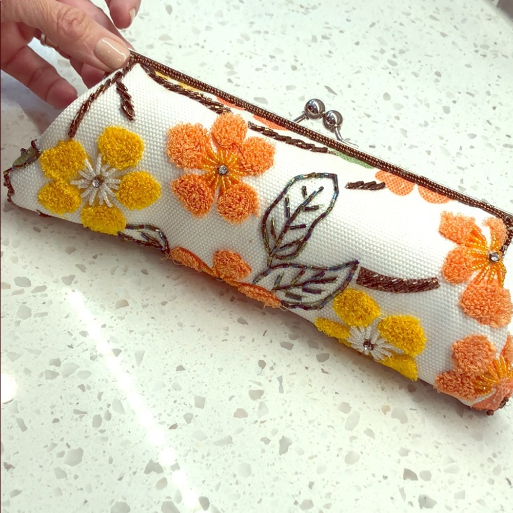 Clutch bag with embroidered and beaded detail
